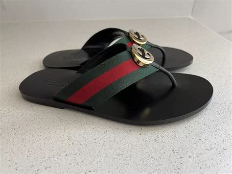 gucci flip flops meaning.